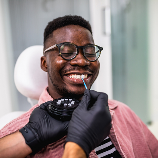 Man having teeth shade matched by cosmetic dentist in Fort Smith