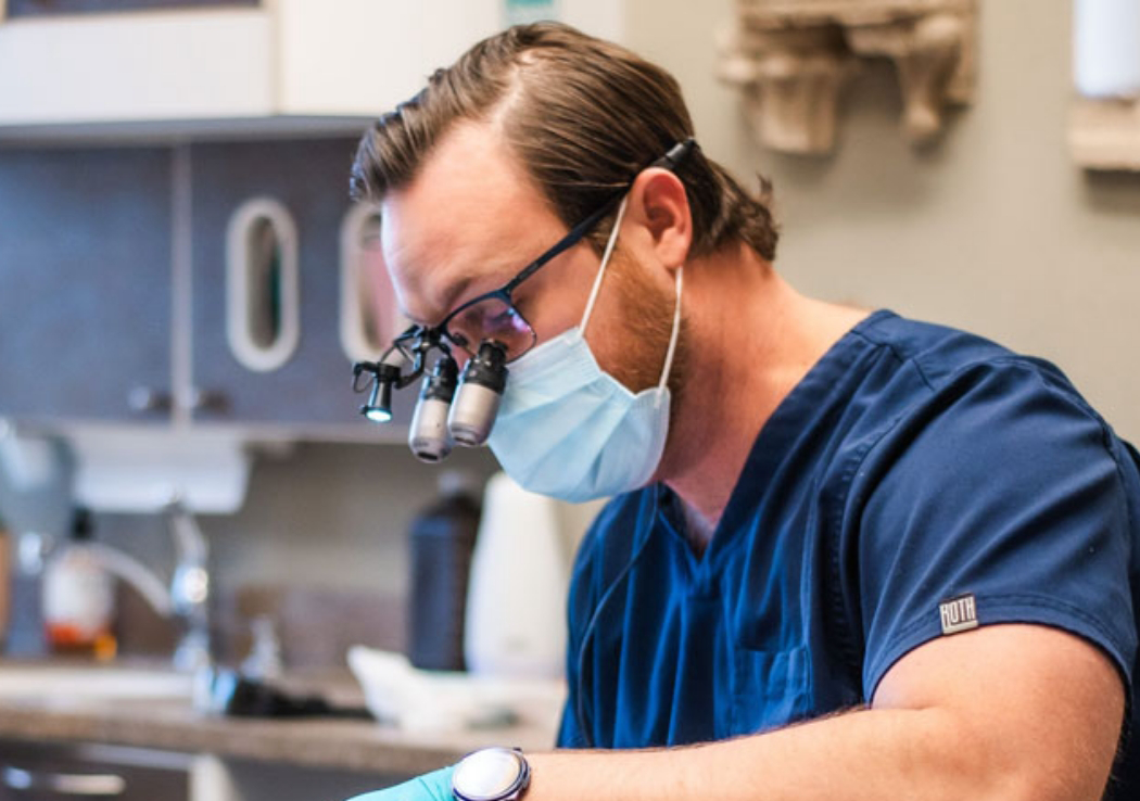 Fort Smith dentist with mask and special glasses