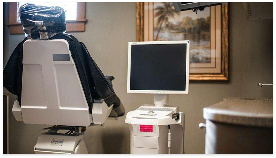 Computer monitor next to dental chair