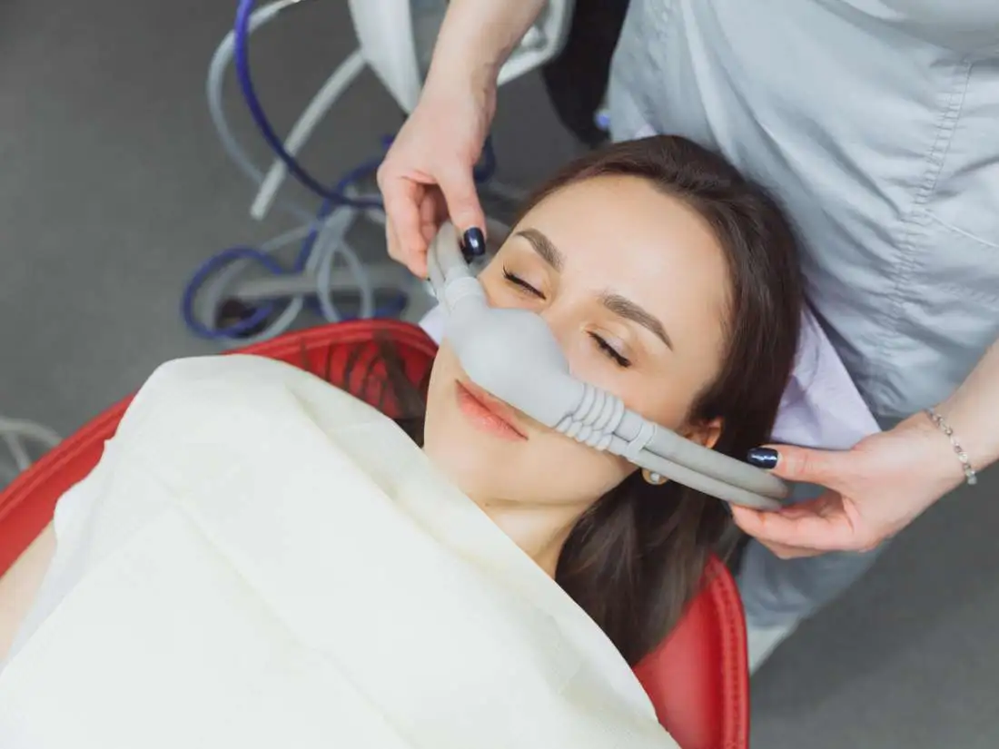 Nasal mask being placed on patients nose