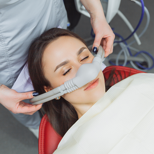 Woman having nasal mask placed for sedation dentistry in Fort Smith